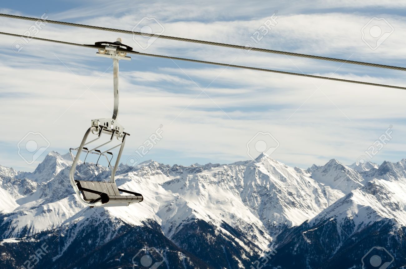 13152647-a-cabin-of-an-chairlift-before-a-snowy-mountain-panorama